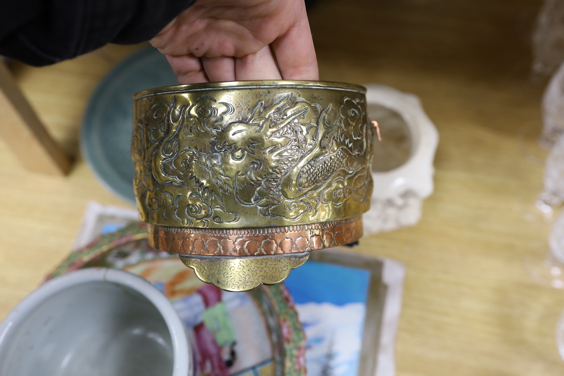 A Chinese blue and white planter, 10cm tall, together with a crackle glaze planter, a Chinese copper and brass jardiniere, a faux bronze type vase, a Chinese famille rose pedestal dish, 23cm, a Thai celadon dish, and a b